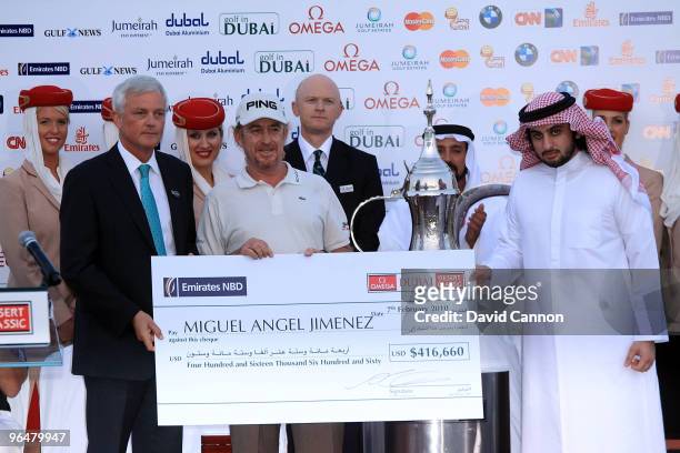 Miguel Angel Jimenez of Spain is presented with the cheque by Sheikh Ahmed Bin Mohammed Bin Rashid Al Maktoum UAE National Olympic Committee the...