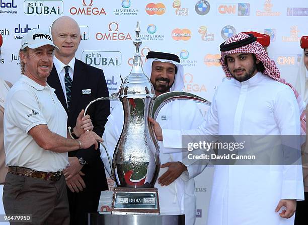 Miguel Angel Jimenez of Spain is presented with the trophy by Sheikh Ahmed Bin Mohammed Bin Rashid Al Maktoum UAE National Olympic Committee as...