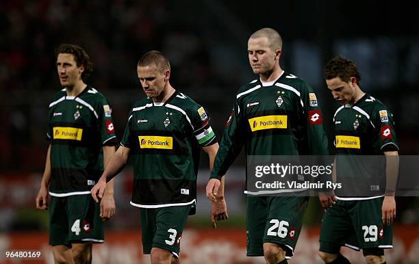 Roel Brouwers, Filip Daems, Michael Bradley and Fabian Baecker of Moenchengladbach look dejected after losing the Bundesliga match between FSV Mainz...