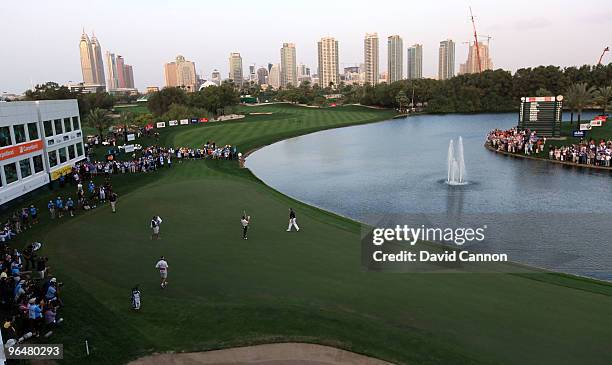 Miguel Angel Jimenez of Spain raises his arms after defeating Lee Westwood of England at the 3rd extra hole the 9th, during the sudden death play-off...