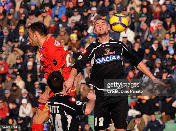 Fabio Quagliarella of Napoli competes with Andrea Coda of Udinese during the Serie A match between Udinese and Napoli at Stadio Friuli on February 7,...