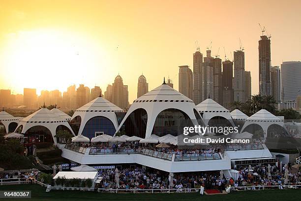 The huge crowds watch the big screen of the play-off from the clubhouse as the sun sets after the final round of the 2010 Omega Dubai Desert Classic...