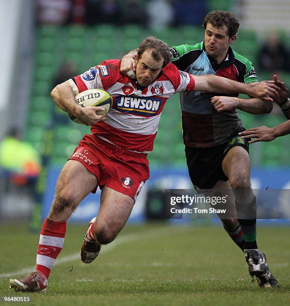 James Simpson-Daniel of Gloucester is tackled by Nick Evans during the LV Anglo Welsh Cup match between Harlequins and Gloucester at The Stoop on...