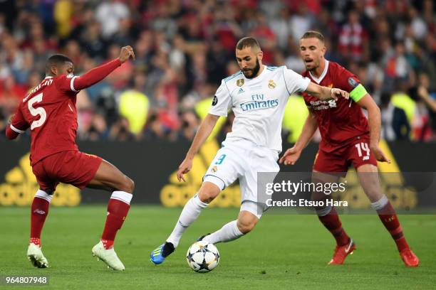 Karim Benzema of Real Madrid controls the ball under pressure of Liverpool defense during the UEFA Champions League final between Real Madrid and...