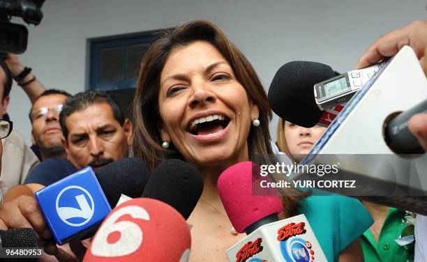 Costa Rican presidential candidate Laura Chinchilla of the ruling National Liberation Party speaks to the press after voting during general elections...