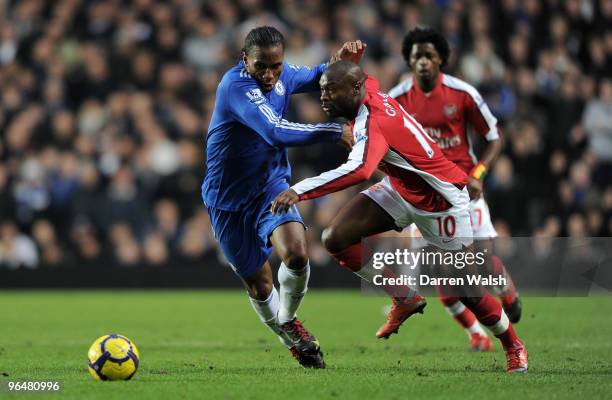 Didier Drogba of Chelsea and William Gallas of Arsenal battle for the ball during the Barclays Premier League match between Chelsea and Arsenal at...