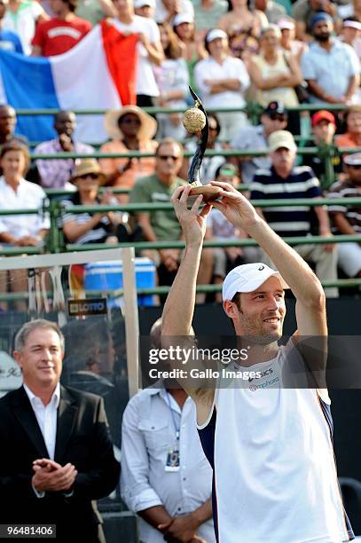 Stephane Robert of France lifts the runner-up trophy after losing the Men's Singles Final against Feliciano Lopez of Spain during day 7 of the 2010...