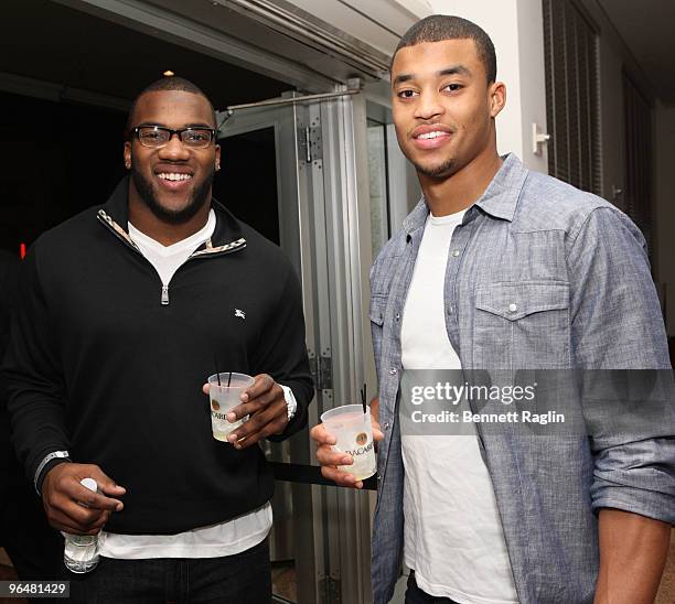 Beanie Wells of the Arizona Cardinals and Brian Robinski of the Cleveland Browns attends Playboy's Super Saturday Night Party presented by Bacardi at...