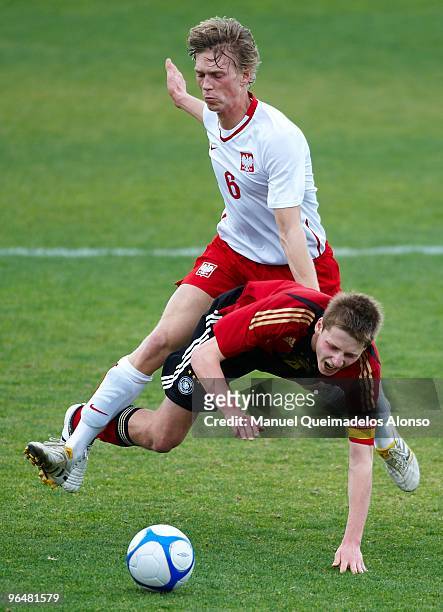Marc Hornschuch of Germany and Bartosz Salamon of Poland compete for the ball during the U19 international friendly match between Germany and Poland...