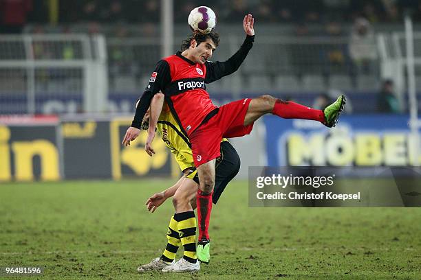 Neven Subotic of Dortmund and Halil Altintop of Frankfurt go up for a header during the Bundesliga match between Borussia Dortmund and Eintracht...