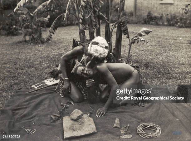 Native doctor attending a patient, There is no official date for this photograph, Zimbabwe, 1940.