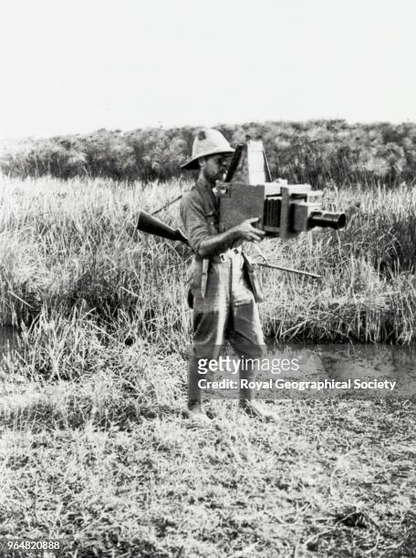 Radcliffe Dugmore with a reflex camera, Africa, 1910.