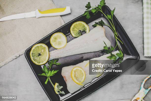 fresh sliced raw hake fish on the cuting board - hake stock pictures, royalty-free photos & images