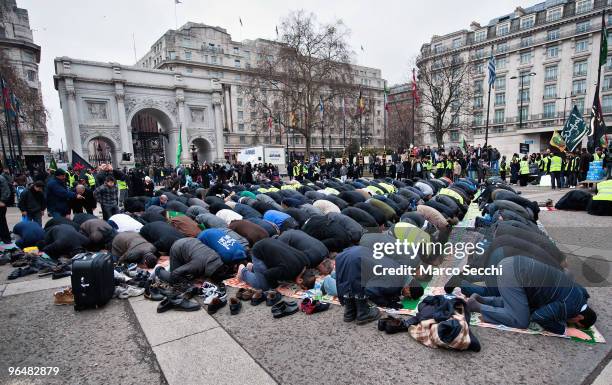 Shiite Muslim devotees pray at Marble Arch ahead of the 29th Arbaeen Procession on February 7, 2010 in London, England. Arbaeen occurs 40 days after...