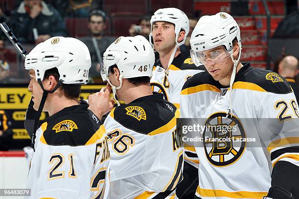 Andrew Ference of the Boston Bruins and teammate Blake Wheeler warm up before the NHL game against the Montreal Canadiens on February 7, 2010 at the...