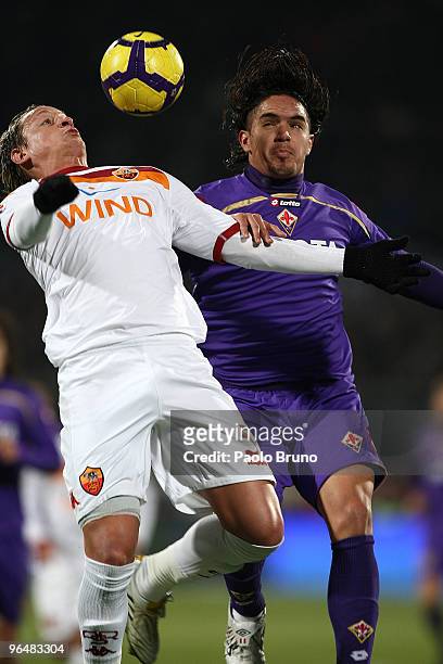 Philippe Mexes of AS Roma and Vargas of ACF Fiorentina in action during the Serie A match between Fiorentina and Roma at Stadio Artemio Franchi on...