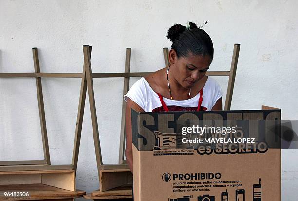 Prisioner votes on February 7 at El Buen Pastor women's prison in San Rafael Arriba de Desamparados, about 6 kilometers south of San Jose, during...