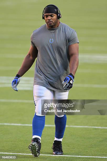 Dwight Freeney of the Indianapolis Colts warms up on the field prior to the start of Super Bowl XLIV between the against the New Orleans Saints on...