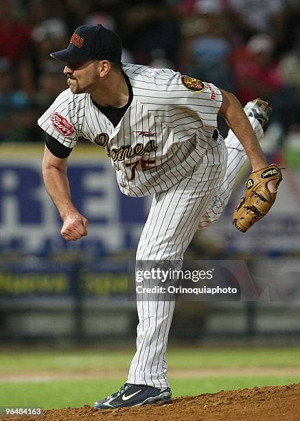 Heath Tottein of Venezuela's Leones del Caracas throws to Puerto Rico's Indios de Mayaguez during the Caribbean Baseball Series 2010 at Guatamare...