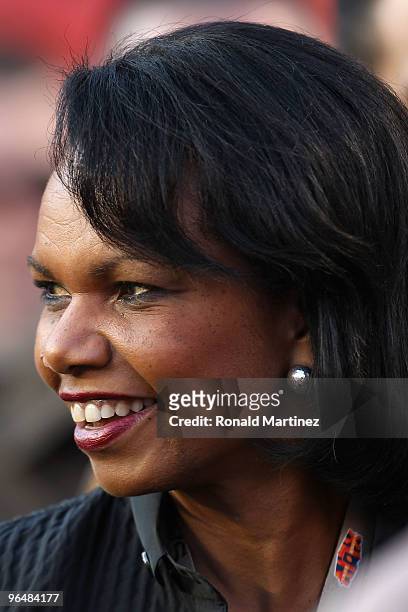 Former Secretary of State Condoleezza Rice watches warms-ups on the field prior to the start of Super Bowl XLIV between the Indianapolis Colts and...