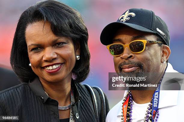 Former Secretary of State Condoleezza Rice and Director Spike Lee watch warms-ups on the field prior to the start of Super Bowl XLIV between the...