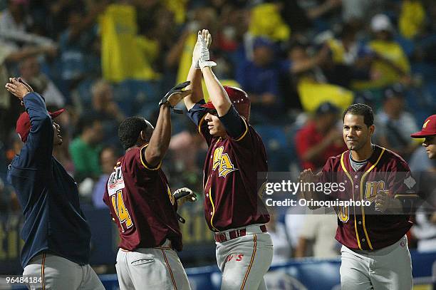Danny Valencia of Puerto Rico's Leones del Caracas celebrates after hitting a home run against Venezuela's Indios de Mayaguez during the Caribbean...