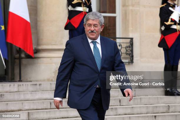 French President Emmanuel Macron welcomes Algeria Prime Minister Ahmed Ouyahia upon his arrival at the Elysee Palace for the international congress...