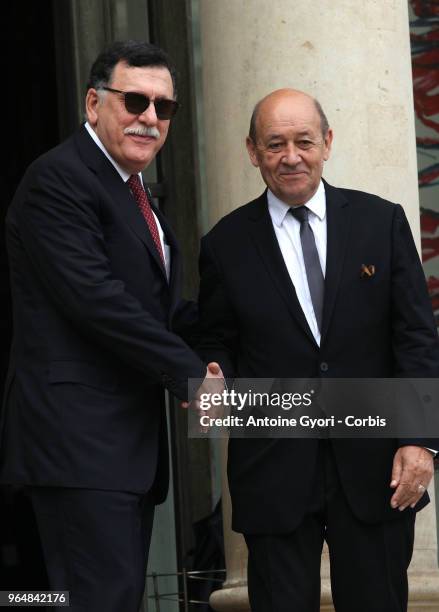 French Foreign Affairs Minister Jean-Yves Le Drian welcomes Chairman of the Presidential Council of Libya, Fayez al-Sarraj upon his arrival for the...