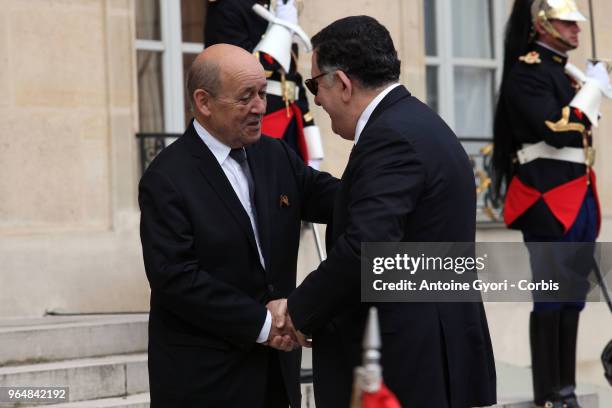 French Foreign Affairs Minister Jean-Yves Le Drian welcomes Chairman of the Presidential Council of Libya, Fayez al-Sarraj upon his arrival for the...