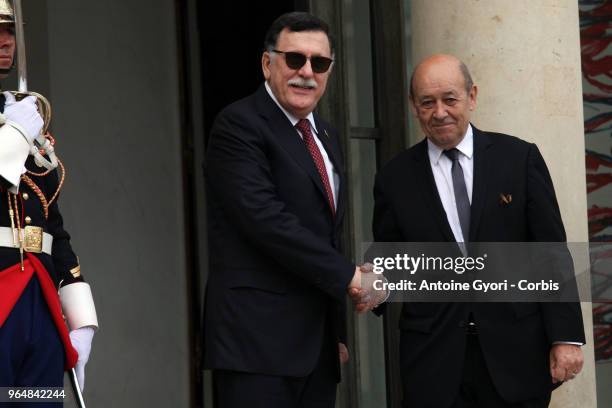 French Foreign Affairs Minister Jean-Yves Le Drian welcomes Chairman of the Presidential Council of Libya, Fayez al-Sarraj upon his arrival for the...