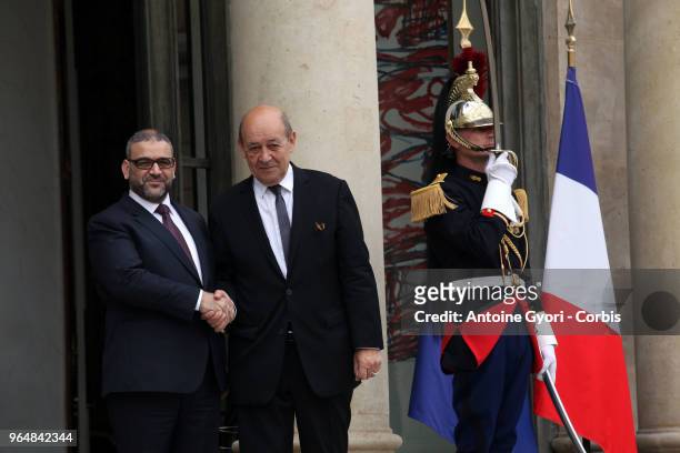 French Foreign Affairs Minister Jean-Yves Le Drian welcomes President of Libya High Council Khaled Mechri upon his arrival for the international...