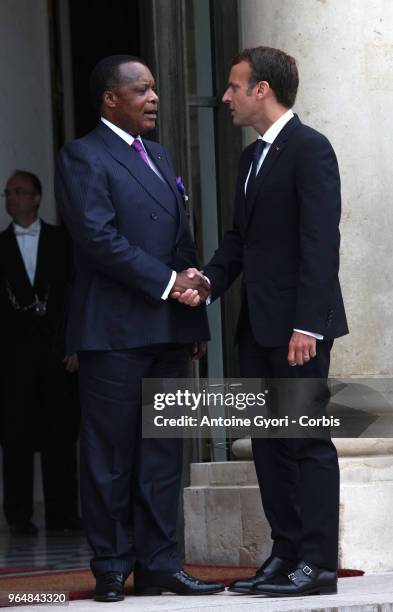 French President Emmanuel Macron welcomes Congo President Denis Sassou Nguesso , upon his arrival for the international congress on Libya, at the...