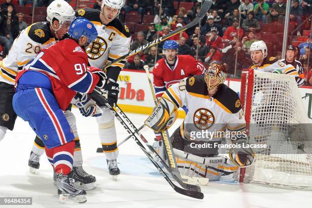 Tuukka Rask of Boston Bruins blocks a shot of Scott Gomez of Montreal Canadiensduring the NHL game on February 7, 2010 at the Bell Centre in...