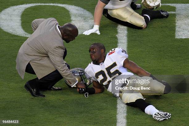Hall of Fame inductee Emmitt Smith speaks with Reggie Bush of the New Orleans Saints prior to the start of Super Bowl XLIV between the Indianapolis...