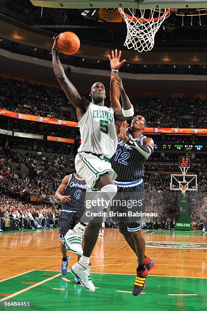 Kevin Garnett of the Boston Celtics goes up for a dunk against Dwight Howard of the Orlando Magic on February 7, 2010 at the TD Garden in Boston,...