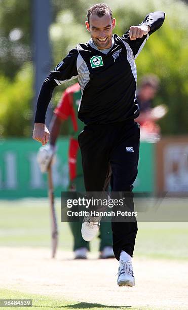 Andrew McKay of New Zealand celebrates the wicket of Tamim Iqbal of Bangladesh during the second One Day International Match between New Zealand and...