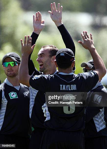 Andrew McKay of New Zealand celebrates the wicket of Tamim Iqbal of Bangladesh during the second One Day International Match between New Zealand and...