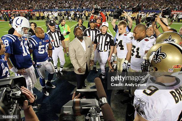 Hall of Famer Emmitt Smith flips the coin prior to the start of Super Bowl XLIV between the Indianapolis Colts and the New Orleans Saints on February...