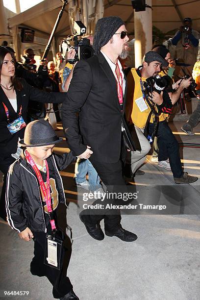 Actor Brad Pitt and Maddox Jolie-Pitt attend Super Bowl XLIV at the Sun Life Stadium on February 7, 2010 in Miami Gardens, Florida.