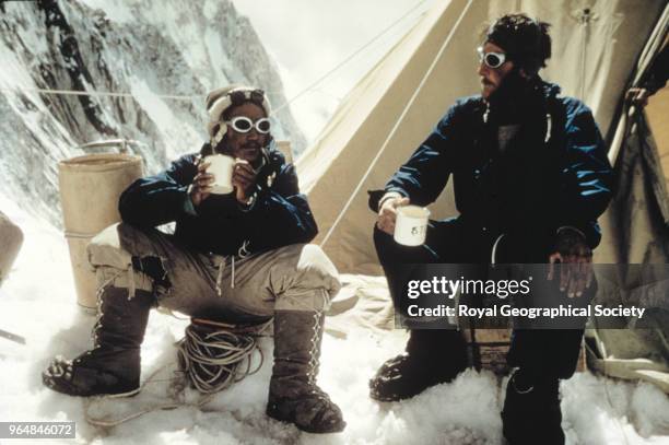 Tenzing Norgay and Edmund Hillary drink tea in the Western Cwm, Tenzing Norgay and Edmund Hillary drink a celebratory cup of tea at Camp IV in the...