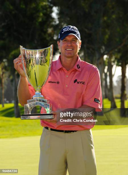 Steve Stricker poses with the tournament trophy after winning the Northern Trust Open at Riviera Country Club on February 7, 2010 in Pacific...