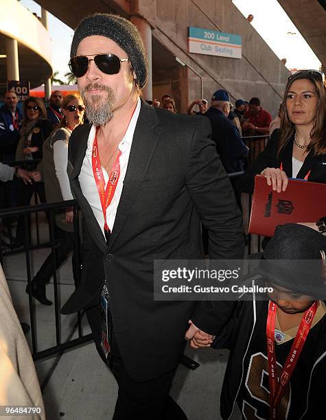 Brad Pitt and Maddox Jolie-Pitt are seen at Super Bowl XLIV at Sun Life Stadium on February 7, 2010 in Miami Gardens, Florida.