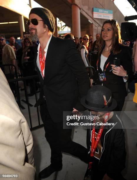 Brad Pitt and Maddox Jolie-Pitt are seen at Super Bowl XLIV at Sun Life Stadium on February 7, 2010 in Miami Gardens, Florida.