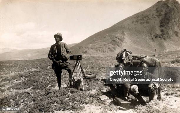 Major Wheeler's photographic survey party, Using photo-topographical surveying instruments, Wheeler with his two assistants methodically photographed...