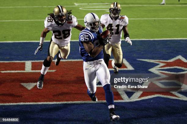 Pierre Garcon of the Indianapolis Colts makes a catch for a touchdown against the New Orleans Saints during the first quarter Super Bowl XLIV on...