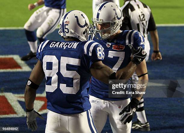 Pierre Garcon of the Indianapolis Colts celebrates after scoring a touchdown with Austin Collie against the New Orleans Saints during the first...