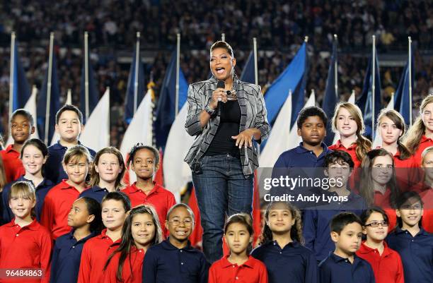 Singer Queen Latifah performs during the pregame show prior to Super Bowl XLIV between the Indianapolis Colts and the New Orleans Saints on February...