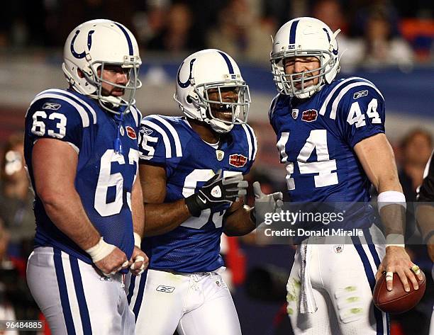 Jeff Saturday, Pierre Garcon and Dallas Clark of the Indianapolis Colts celebrate after a touchdown in the first quarter against the New Orleans...