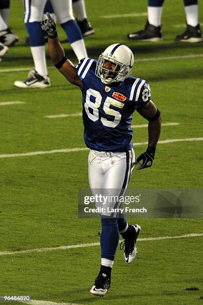 Pierre Garcon of the Indianapolis Colts runs off the field after making a catch for a touchdown against the New Orleans Saints during the first...