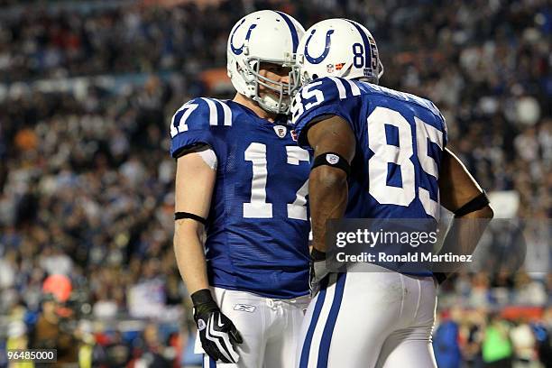 Pierre Garcon of the Indianapolis Colts celebrates after scoring a touchdown with Austin Collie against the New Orleans Saints during the first...